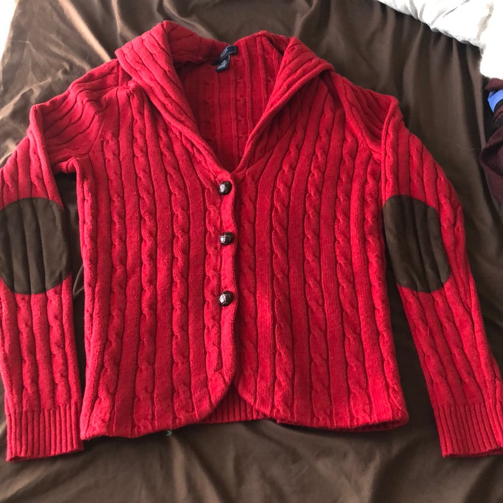 Red button-up cardigan with brown elbow pads